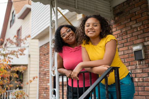 Black family to the camera in front of their house1289078458Digital files related to safe, healthy, affordable housing, and homeownership under the Place purpose area.